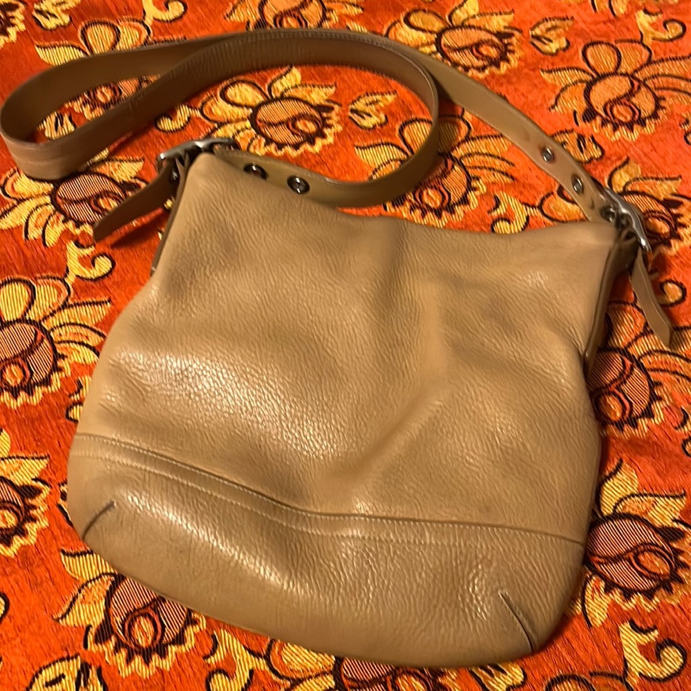 leather crossbody spots front left bottom wear signs on bottom ink stains inside